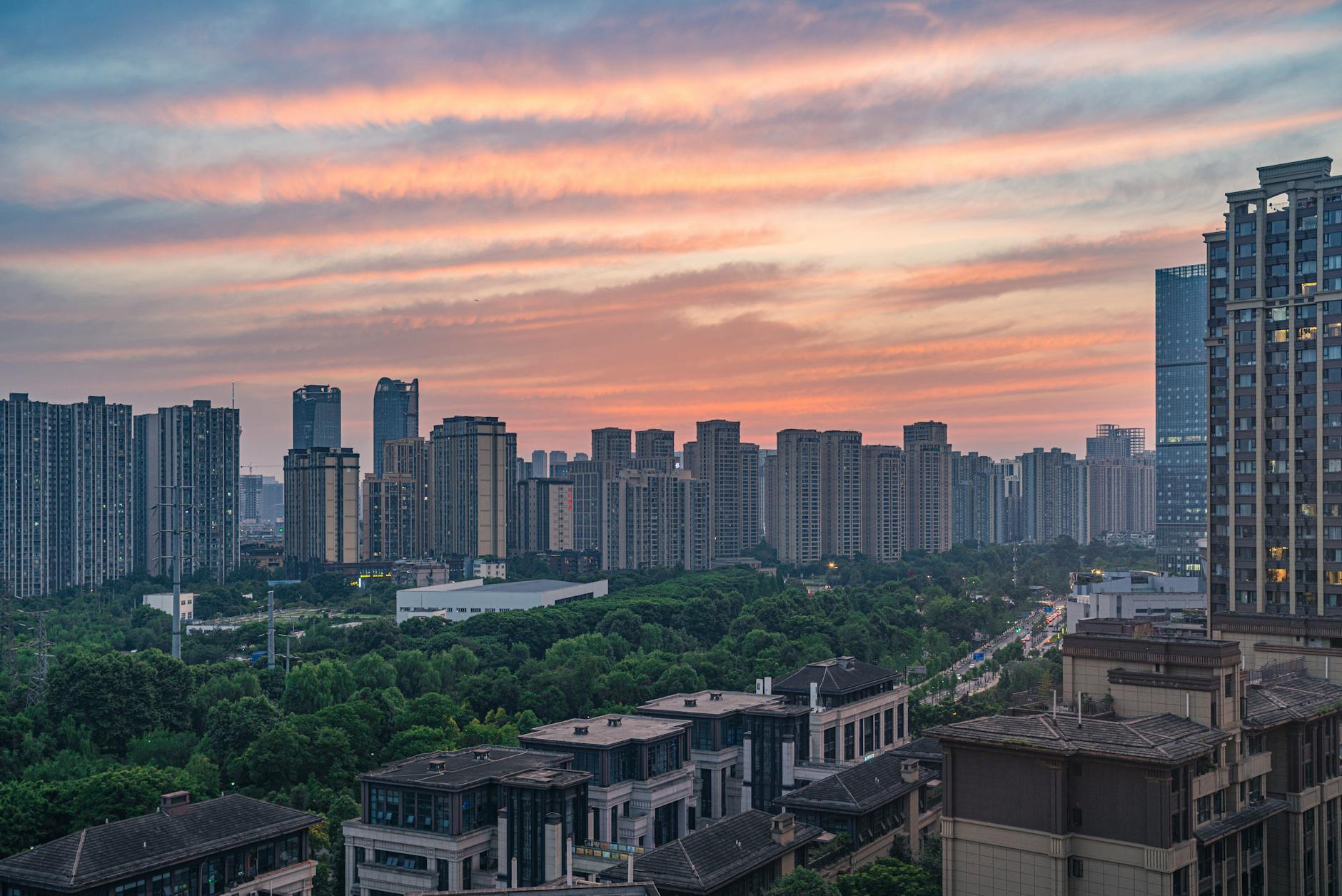 aerial photography of high rise buildings in the city during sunset